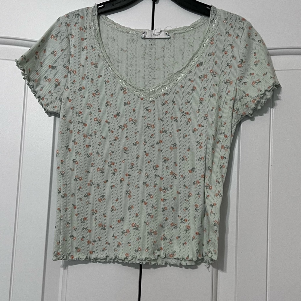 Frilly light blue shirt